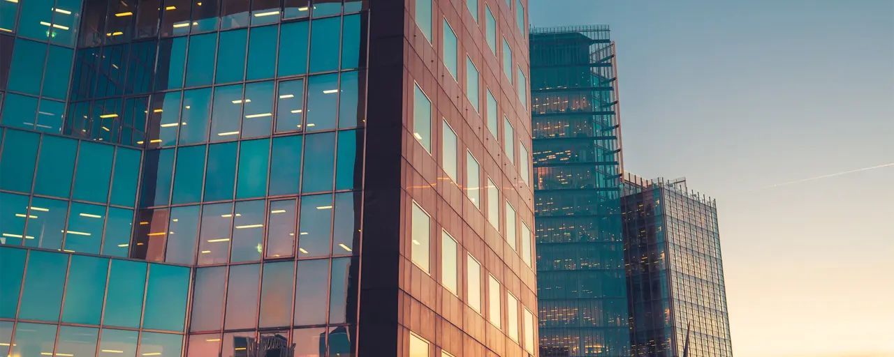 Glass skyscraper buildings at sunset