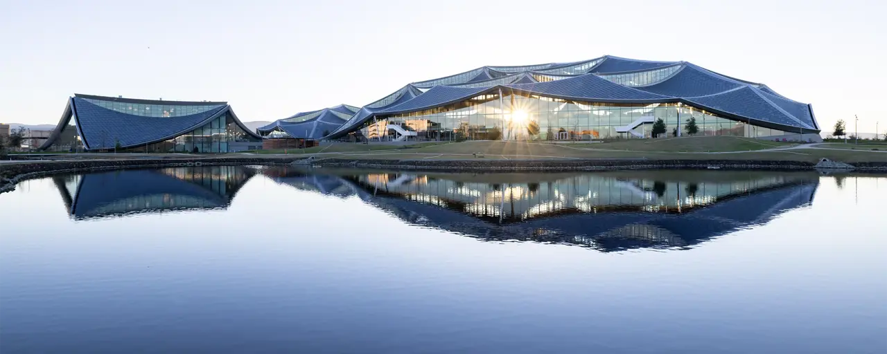 View of the Google Bay view campus with the sun setting on the building