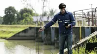 A technician use the Professional Water Testing equipment to measure the water quality at the public canal, Portable multi parameter water quality measurement , water quality monitoring concept.