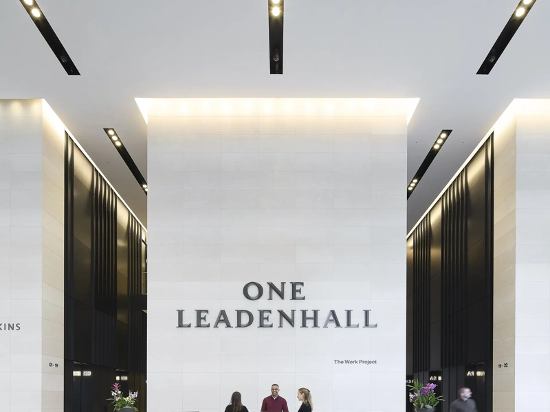 One Leadenhall reception with high-reaching white walls and company logo, London, UK