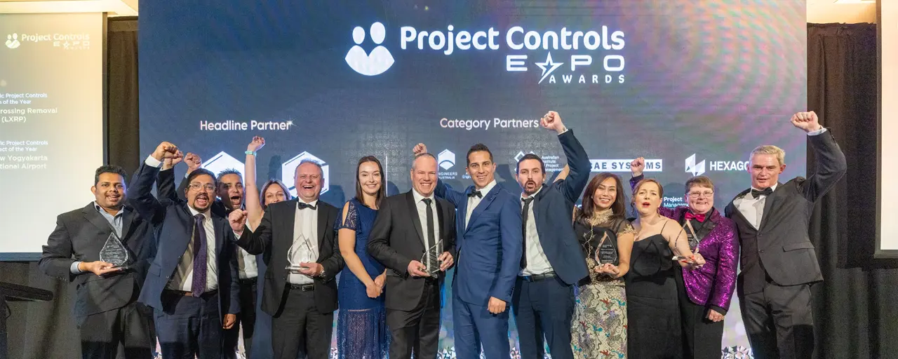 Turner & Townsend Australia team attend the Asia Pacific Project Controls award and celebrating the award as team with holding the award in their hands.