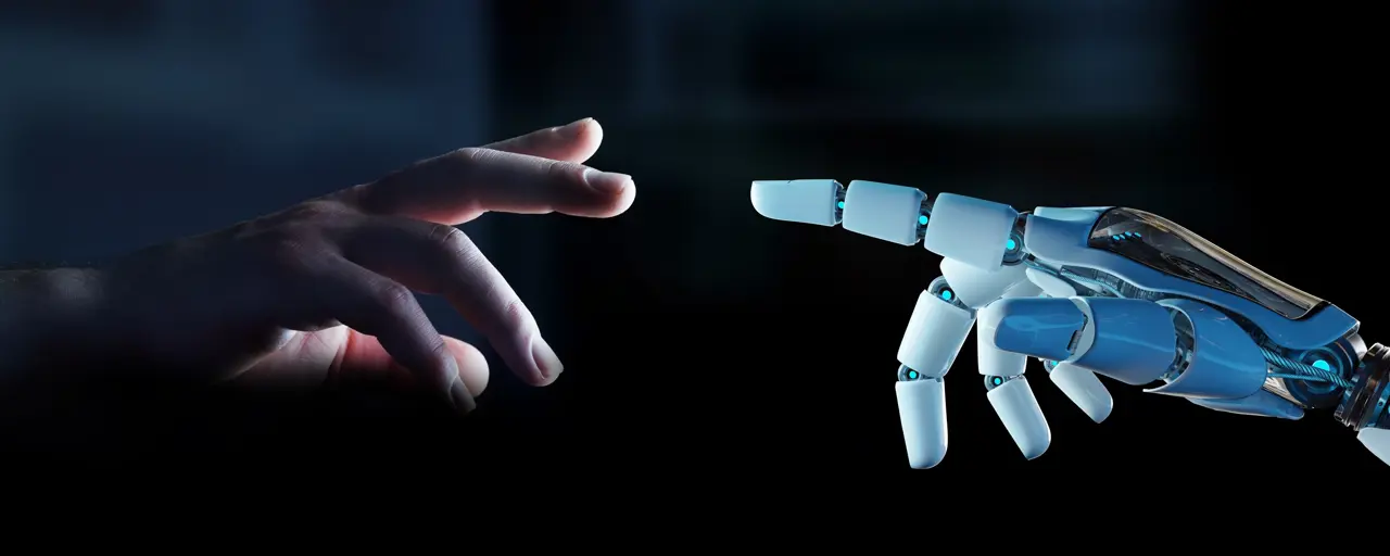 Human hand reaching out to robotic hand