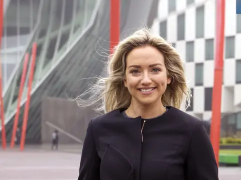 Lisa Duigan, Data Centres Sector Lead, Europe, outside in front of a modern office building