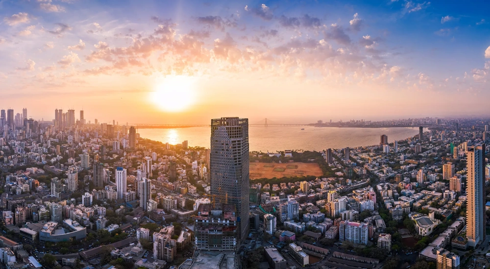 The Bandra Worli Sea Link is seen passing over the Mahim Bay, with the city around it. Dadar, Prabhadevi, Lower Parel, Worli, Matunga, Mahim and Bandra can be seen.