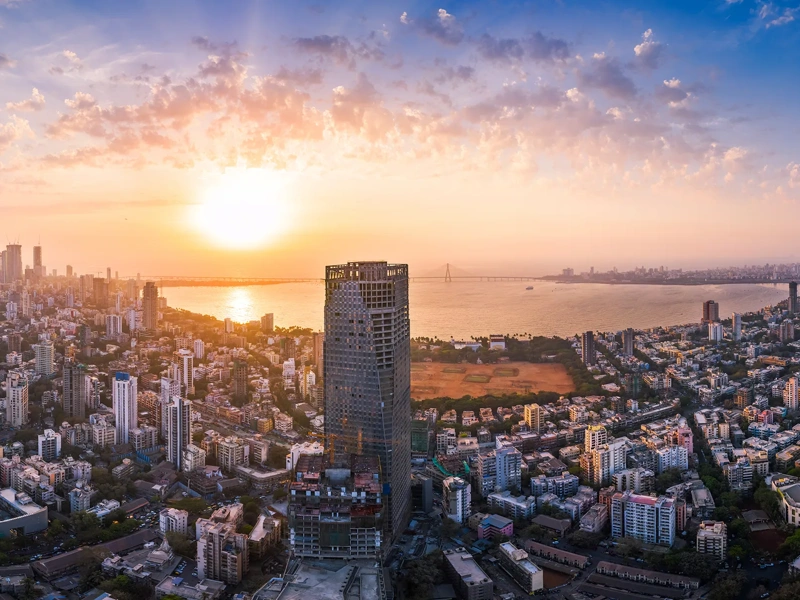 The Bandra Worli Sea Link is seen passing over the Mahim Bay, with the city around it. Dadar, Prabhadevi, Lower Parel, Worli, Matunga, Mahim and Bandra can be seen.