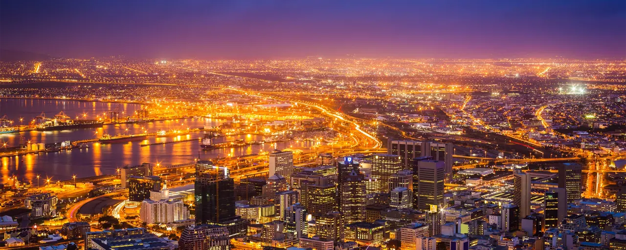 View of South Africa City in the evening with skyscraper lit up by lights.