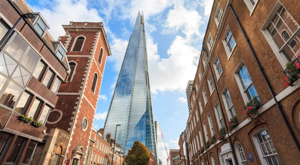 Tall brown buildings surrounding the Shard