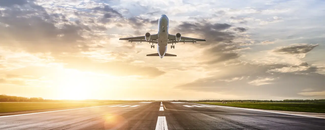 Passenger airplane taking of at sunrise