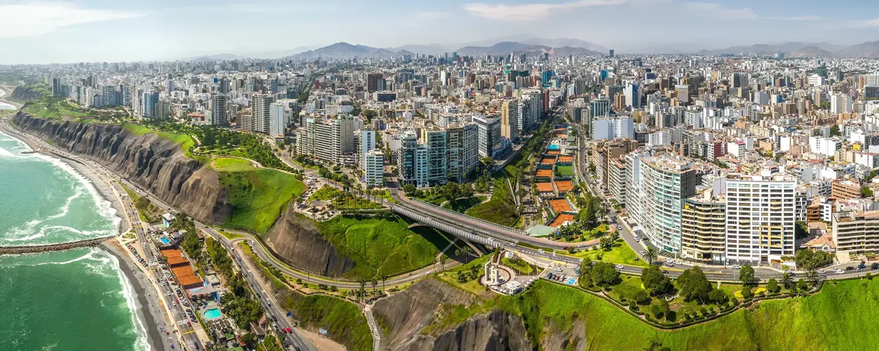 Aerial view of Miraflores town, cliff and the Costa Verde high way