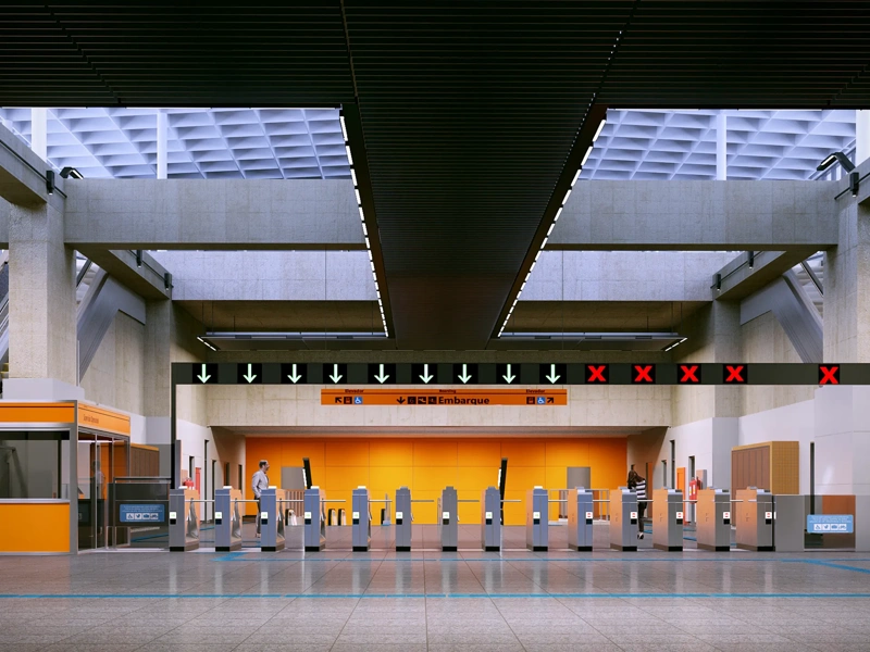 Modern metro station entrance with ticket barrier escalators and overhead signage