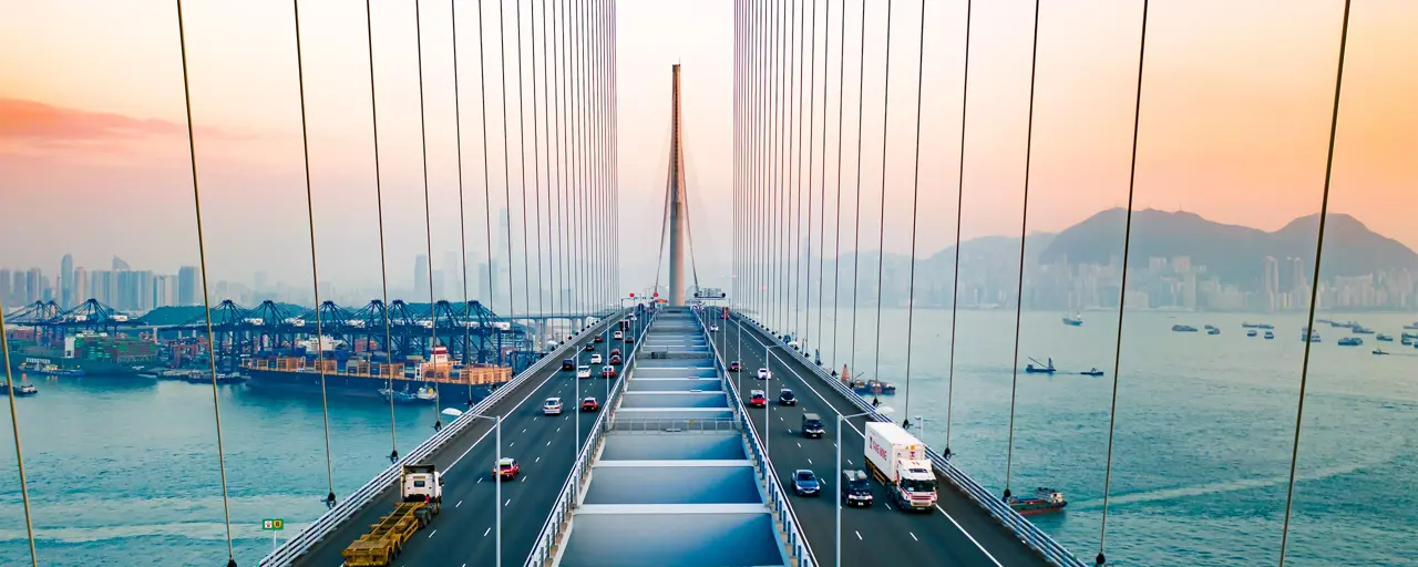 Drone view of Stonecutters Bridge and the Tsing sha highway at sunset.