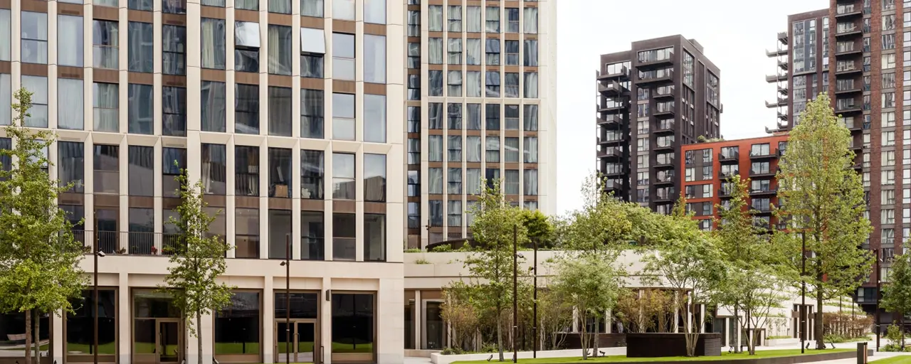 Buildings surrounded by grass and trees