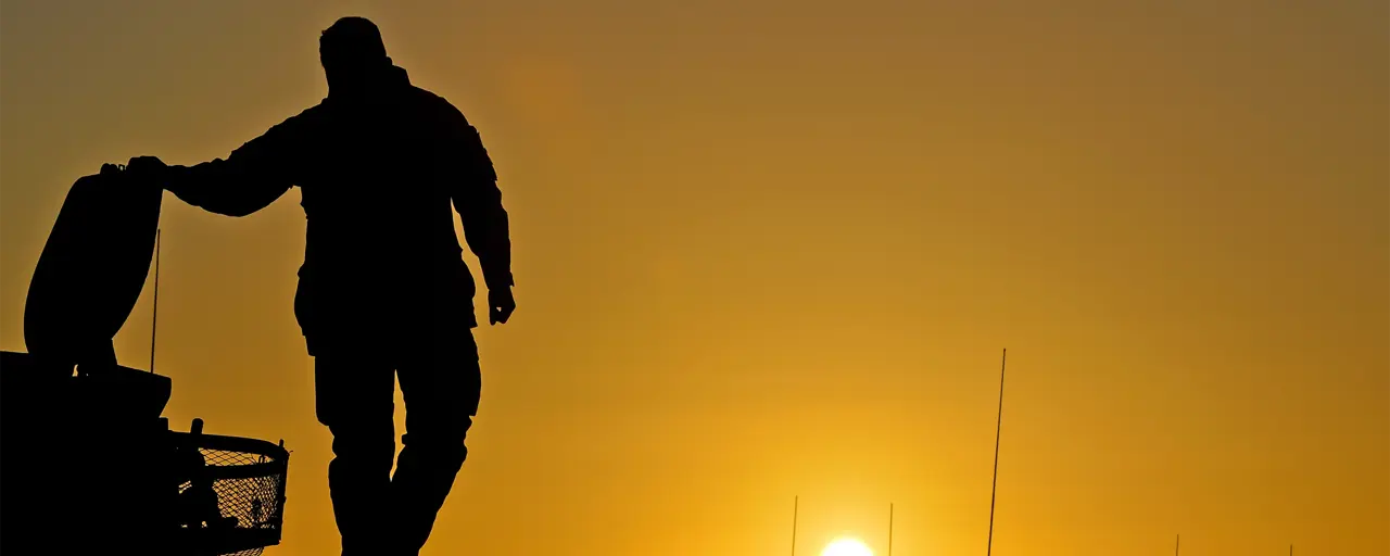 Silhouette of a person against the sun