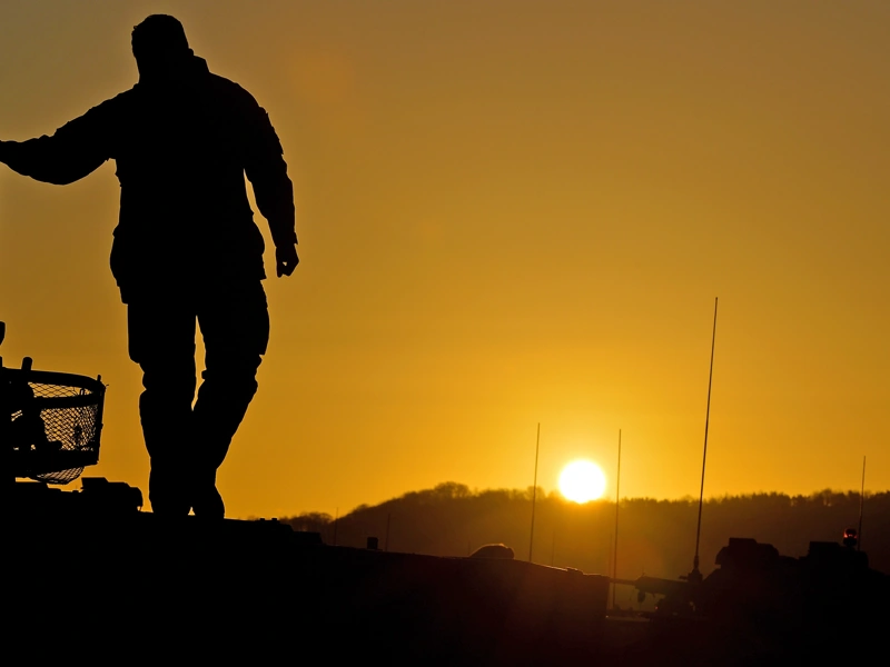 Silhouette of a person against the sun
