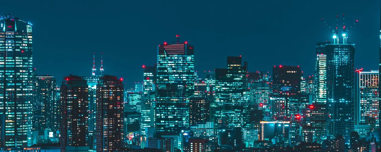 Japan skyscrapers lit up in the dark