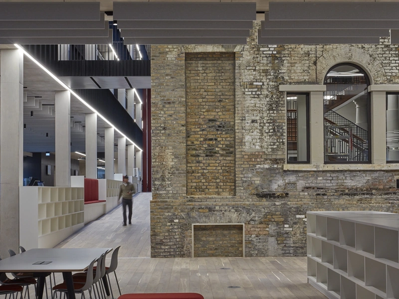 Interior of Tower Hamlets Town Hall featuring a mix of bare brick and modern architecture, London, UK