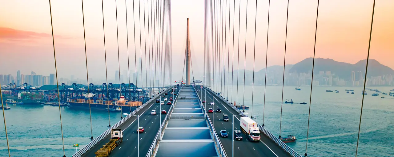 View of a bridge that cars and lorries are crossing by