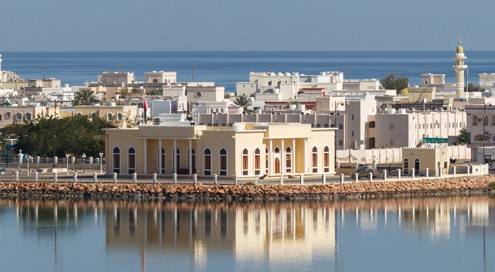 Across the water shot of Oman Refineries and Petro Chemicals (ORPIC) against a blue sky