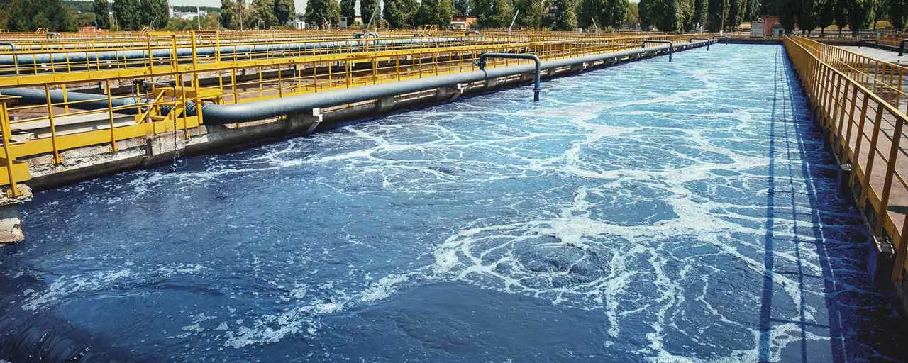 View of water being tunnelled through industrial area