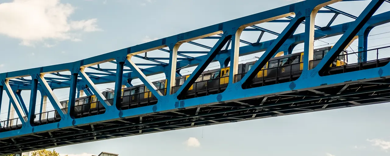 Image of railway bridge with train passing by