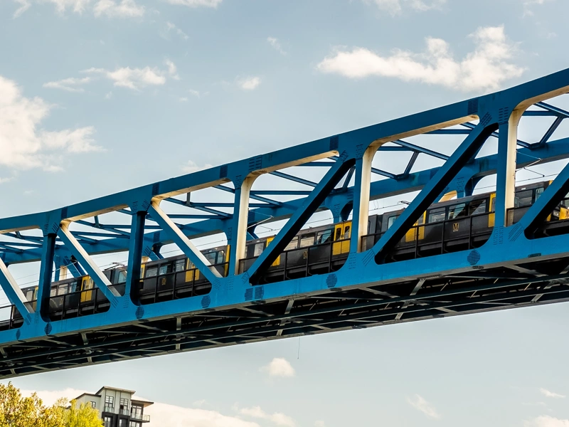 Image of railway bridge with train passing by