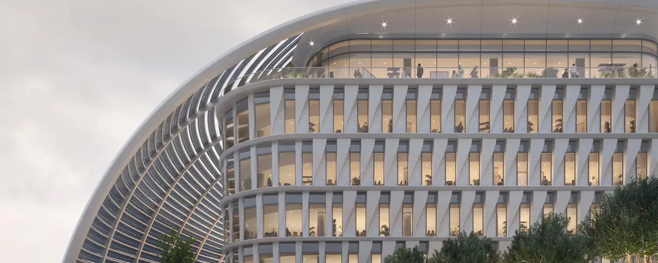 A futuristic, white multi-story office campus building. 