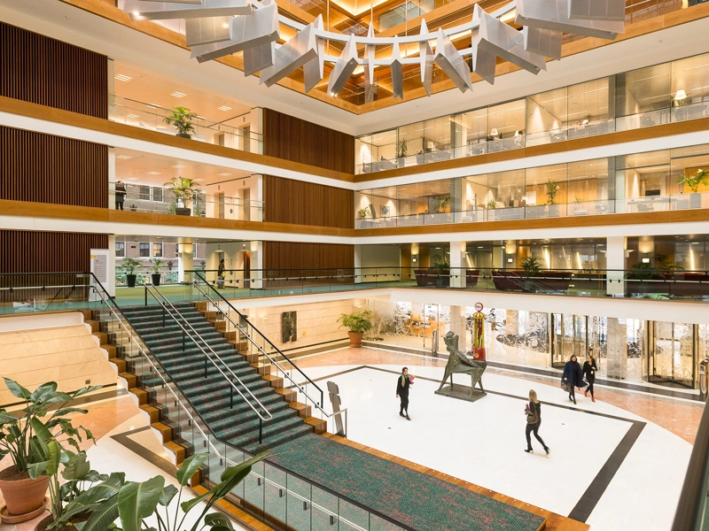Shell's offices in The Hague, The Netherlands, a modern, open-plan atrium with large staircase