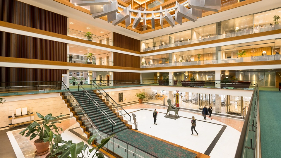 Shell's offices in The Hague, The Netherlands, a modern, open-plan atrium with large staircase