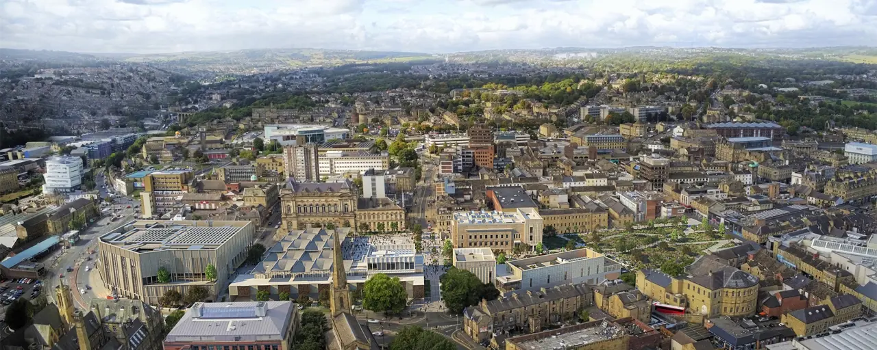 Birdseye view of town with greenery around it