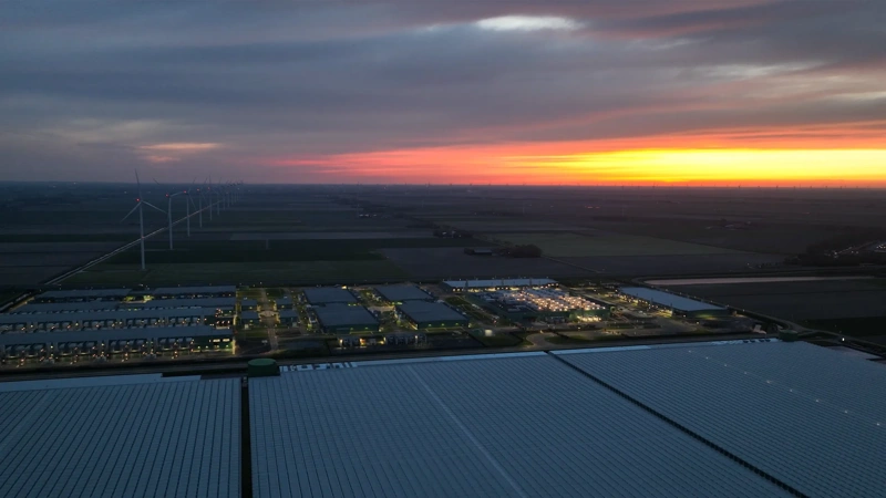Large scale data center building complex in Middenmeer, The Netherlands, at night. Aerial view.