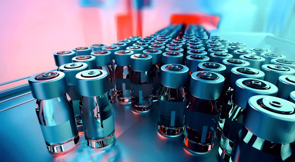 Large group of glass vials in a lab on a metal tray