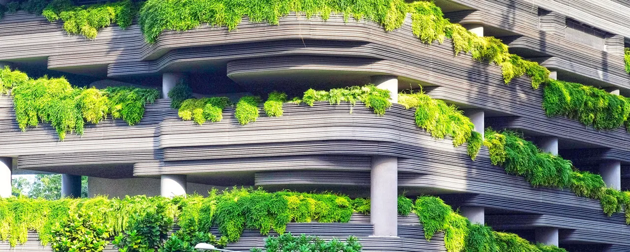Multi storey car park with over flowing green plants