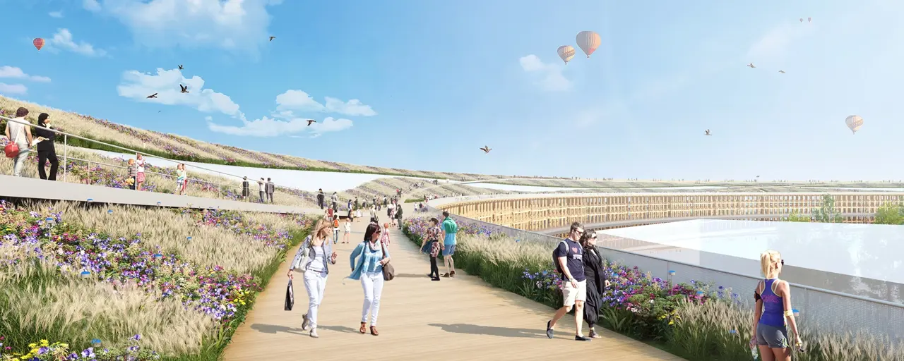 Rendered image of promenade with people walking and exercising and hot air balloons in the distance
