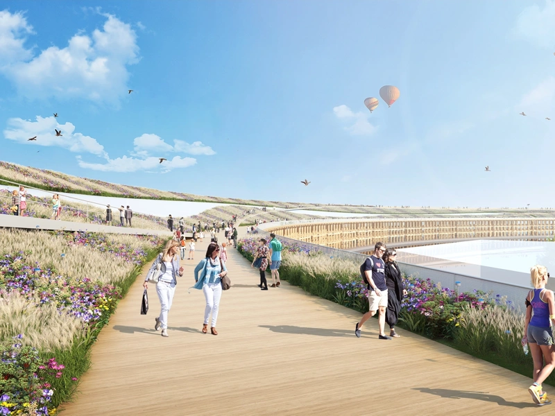 Rendered image of promenade with people walking and exercising and hot air balloons in the distance