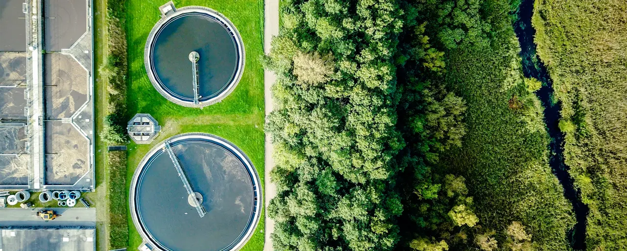 Aerial shot of water tanks in field