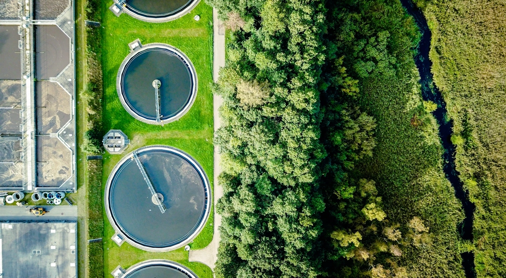 Aerial shot of water tanks in field